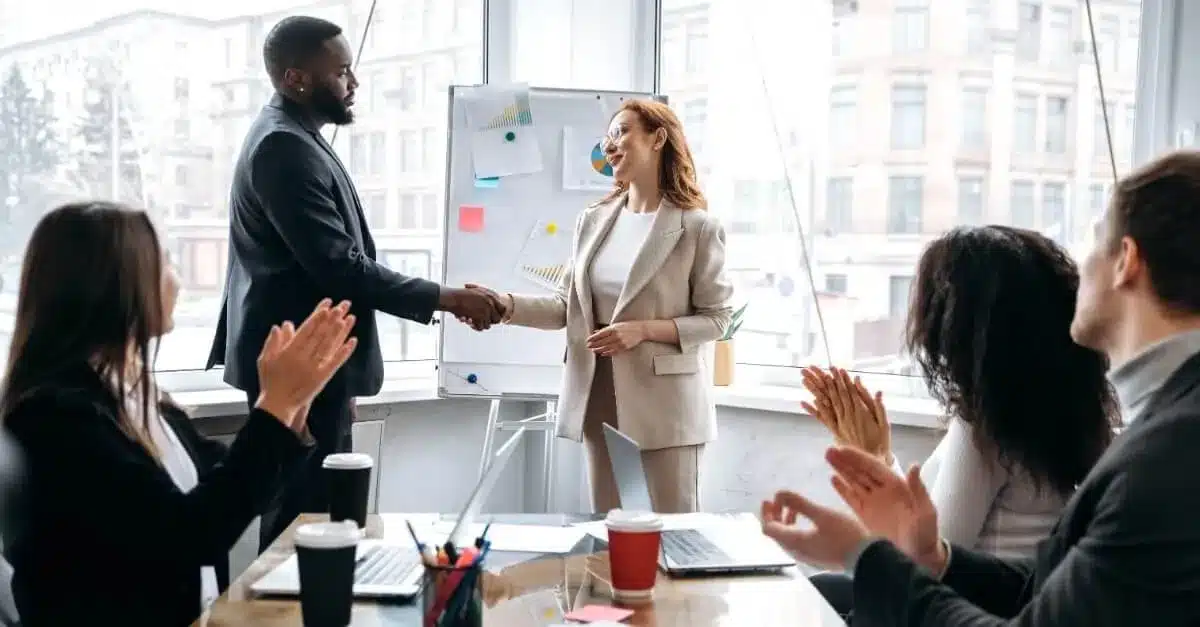 Business Coach And Client Hand Shaking