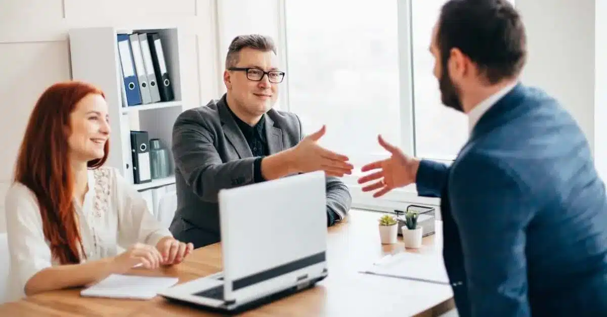 Business Coach And Couple Hand Shaking